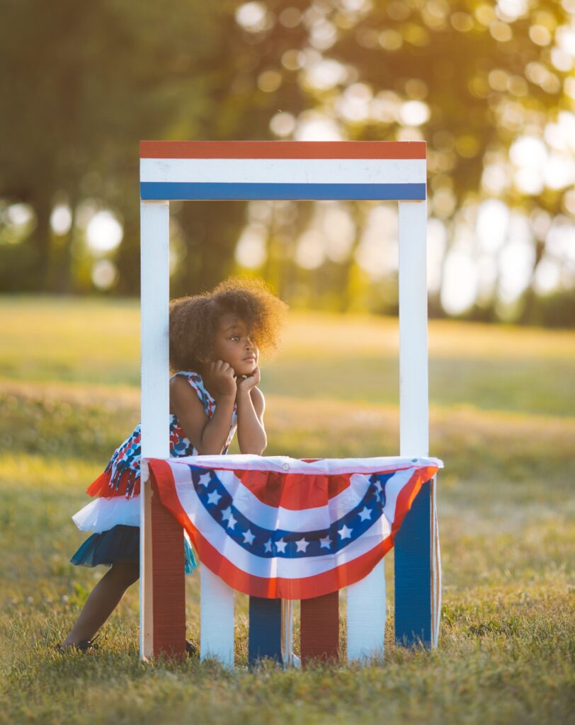 girl in patriotic booth